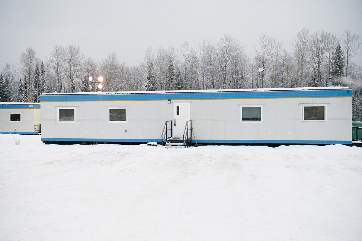 exterior shot of lodge with snow and trees