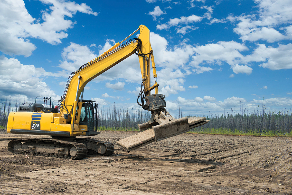 excavator installing access matting
