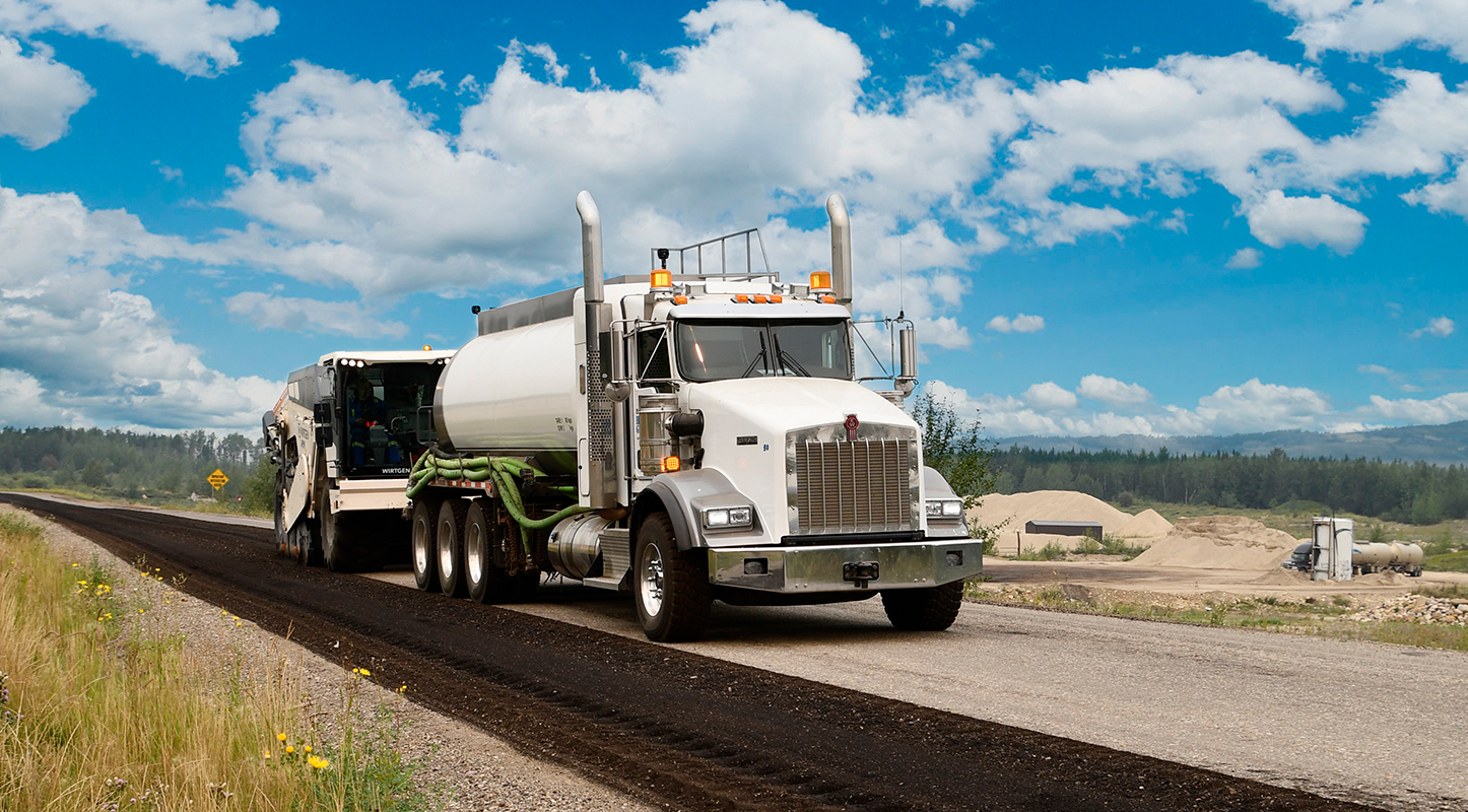 truck driving over a well maintained road