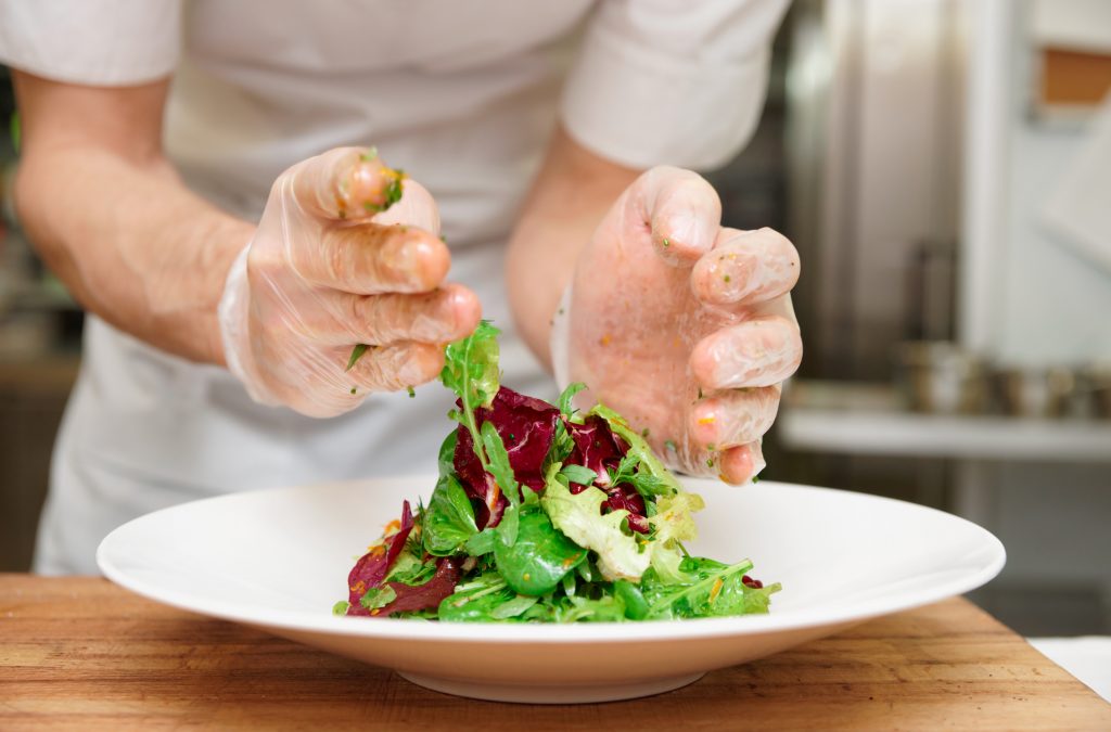 A chef making an appetizer
